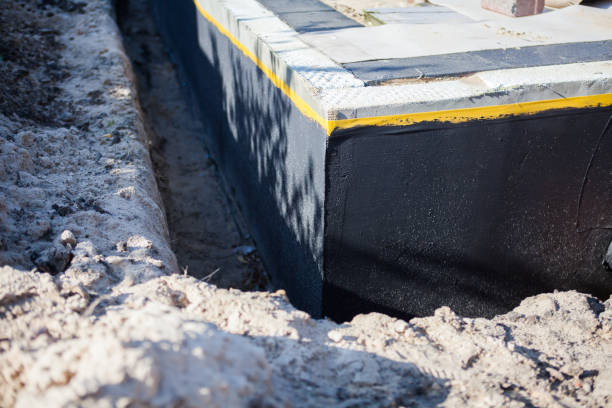 Professional Waterproofing technician working in Willis, MI
